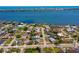 Picturesque aerial view showcasing home's proximity to the water and nearby city skyline at 150 Nautical Dr, South Daytona, FL 32119