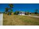 Charming single story home with an attached garage, nicely kept lawn and mature trees at 150 Nautical Dr, South Daytona, FL 32119