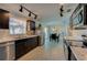 Bright kitchen featuring stainless steel appliances, dark cabinets, and an adjacent dining area at 150 Nautical Dr, South Daytona, FL 32119