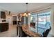 Spacious kitchen area offering backyard pool view with stainless steel appliances and dark wood cabinetry at 150 Nautical Dr, South Daytona, FL 32119