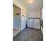 Bright laundry room with washer, dryer, and added shelving for ample storage space at 150 Nautical Dr, South Daytona, FL 32119