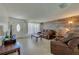Inviting living room featuring tile floors, stylish wood accent wall, and ample natural light at 150 Nautical Dr, South Daytona, FL 32119