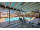 Screened-in pool area with outdoor seating, providing a private backyard oasis at 150 Nautical Dr, South Daytona, FL 32119