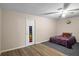 Cozy bedroom with hardwood flooring and natural light, complete with ceiling fan at 1560 S Pearl St, Deland, FL 32720
