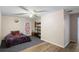 Spacious bedroom with a ceiling fan, shelving, a colorful door and a bed at 1560 S Pearl St, Deland, FL 32720