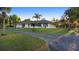 Home exterior with palm tree, side driveway, and well kept lawn at 1560 S Pearl St, Deland, FL 32720