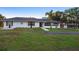 Ranch style home with a well manicured front yard at 1560 S Pearl St, Deland, FL 32720