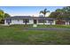 Charming single story home with a well-maintained lawn and mature landscaping at 1560 S Pearl St, Deland, FL 32720