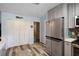 Well-lit kitchen features stainless steel appliances, abundant storage and breakfast area at 1560 S Pearl St, Deland, FL 32720