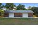 Large outbuilding has metal roof, two bays and natural wood siding at 1560 S Pearl St, Deland, FL 32720