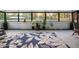 Sunroom offers tile floors, area rug, and large windows at 1560 S Pearl St, Deland, FL 32720