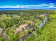 A neighborhood aerial view showing the waterfront homes with private docks and swimming pools at 1578 Stone Trl, Deltona, FL 32725