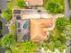 Aerial view of the property with a pool, screened lanai, boat dock, and lush landscaping at 1578 Stone Trl, Deltona, FL 32725