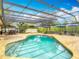 Sparkling pool area with a screened enclosure, lush landscaping, and plenty of room for relaxation and entertainment at 1578 Stone Trl, Deltona, FL 32725