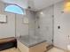 Modern bathroom featuring a frameless glass shower with tile surround and updated fixtures at 1578 Stone Trl, Deltona, FL 32725