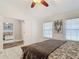 Bedroom with large windows, doorways, and decorative wall art at 1578 Stone Trl, Deltona, FL 32725