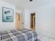 Bright bedroom features white walls, tiled floors, a ceiling fan, and access to other rooms at 1578 Stone Trl, Deltona, FL 32725
