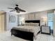 Comfortable bedroom features neutral tones, stylish décor, and a ceiling fan at 1578 Stone Trl, Deltona, FL 32725