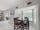Breakfast nook offering natural light and views of the pool area, seamlessly flowing into the indoor dining space at 1578 Stone Trl, Deltona, FL 32725