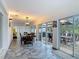 Dining room with tiled floors and views of patio and outdoor seating area at 1578 Stone Trl, Deltona, FL 32725