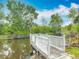 A charming wooden dock on the canal, ideal for relaxation and enjoying the waterfront at 1578 Stone Trl, Deltona, FL 32725