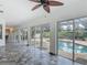 Hallway with tiled floors and sliding doors leading to outdoor pool area at 1578 Stone Trl, Deltona, FL 32725