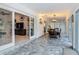 Hallway featuring tiled floors and views into living room and dining room at 1578 Stone Trl, Deltona, FL 32725