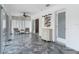 Hallway with tiled floors, decor, and views into the sunroom at 1578 Stone Trl, Deltona, FL 32725