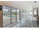Hallway with large windows overlooking a pool and outdoor area, offering plenty of natural light at 1578 Stone Trl, Deltona, FL 32725