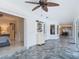 Hallway featuring tiled floors and decor, leading into bedroom and dining room at 1578 Stone Trl, Deltona, FL 32725