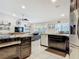 Open kitchen featuring dark wood cabinetry, stainless steel appliances, and granite countertops, flowing into the living area at 1578 Stone Trl, Deltona, FL 32725