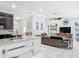 Bright living area showcasing open floor plan and seamless connection to the kitchen at 1578 Stone Trl, Deltona, FL 32725