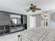 Spacious main bedroom with ceiling fan, entertainment center, and ensuite bathroom at 1578 Stone Trl, Deltona, FL 32725