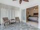 Sunroom with tiled floors and view of bedroom with neutral-colored decor at 1578 Stone Trl, Deltona, FL 32725