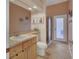 Bright bathroom with a vanity, toilet, and a glass-enclosed shower, providing a functional space at 1933 Oak Estates Dr, Orange City, FL 32763
