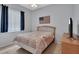 Comfortable bedroom with a queen bed, window, and TV; perfect for relaxation at 1933 Oak Estates Dr, Orange City, FL 32763