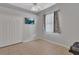 Clean bedroom with a closet, TV, and large window; offering ample space and natural light at 1933 Oak Estates Dr, Orange City, FL 32763