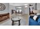 Inviting dining room featuring a chandelier, tile floors, and natural light, adjacent to the living area at 1933 Oak Estates Dr, Orange City, FL 32763