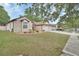 Beautiful single-story home with a three-car garage, landscaped yard, and charming curb appeal at 1933 Oak Estates Dr, Orange City, FL 32763