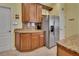 Additional kitchen view, featuring stainless steel refrigerator and convenient counter space at 1933 Oak Estates Dr, Orange City, FL 32763