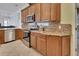Close up of kitchen details showing stainless steel appliances, granite countertops and wooden cabinets at 1933 Oak Estates Dr, Orange City, FL 32763