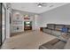 Another view of the living area with built-in shelving, neutral wall paint, and a comfortable leather sofa at 1933 Oak Estates Dr, Orange City, FL 32763