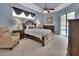 Relaxing main bedroom with a king bed and outdoor views of the pool at 1933 Oak Estates Dr, Orange City, FL 32763