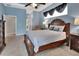 Inviting main bedroom features blue walls, tile floors, and lots of natural light at 1933 Oak Estates Dr, Orange City, FL 32763