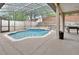 Screened-in pool with a spa offers a private backyard oasis at 1933 Oak Estates Dr, Orange City, FL 32763