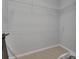 Bright walk-in closet with white wire shelving and rod, ready for personalized organization at 1933 Oak Estates Dr, Orange City, FL 32763