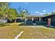 Spacious backyard with lush lawn and an inviting outdoor living space at 1941 Jungle Rd, New Smyrna Beach, FL 32168