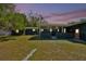 Spacious backyard featuring a covered porch and detached garage at 1941 Jungle Rd, New Smyrna Beach, FL 32168