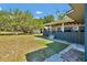 Well-maintained backyard with lawn and view of house and garage at 1941 Jungle Rd, New Smyrna Beach, FL 32168