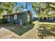Landscaped backyard featuring green grass and mature trees at 1941 Jungle Rd, New Smyrna Beach, FL 32168